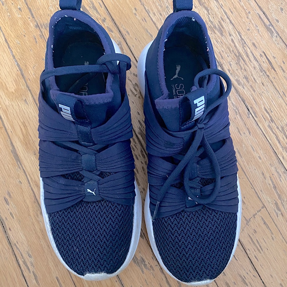 US woman’s 8, navy blue puma sneakers.